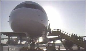 Passengers boarding plane