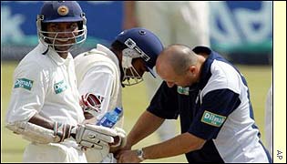 Jayawardene receives treatment from the team physio