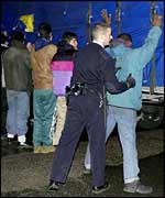 Aslyum seekers being searched at Calais