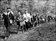 Khmer Rouge leader Pol Pot leads a column of his men