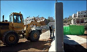 Bulldozer working on rebuilding of Hebron