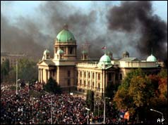 Smoke rises from the Yugoslav federal parliament, 05/10/00