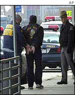 Arrested airport worker is led away