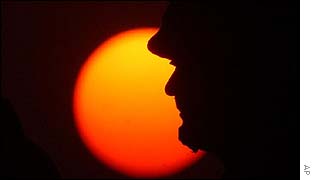 US soldier silhouetted by the sun