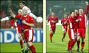 John Hartson leaps high at the far post to score Wales' second in the 67th minute as his team-mates join him to celebrate