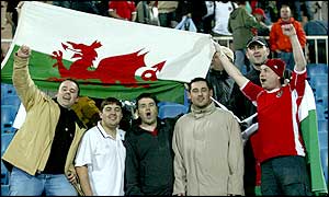 Travelling supporters celebrate a 2-0 win over Azerbaijan as they look almost certain of a place in the Euro 2004 finals in Portugal