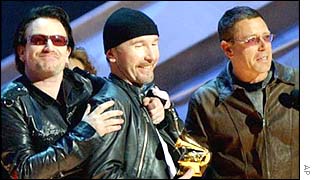 U2 members accepting a Grammy award in February