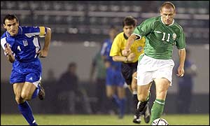 Ireland's Glen Crowe of Ireland is chased by Greece's Nikos Dabiazas
