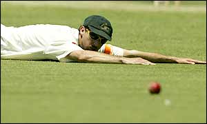 Australian bowler Jason Gillespie fails to stop a drive