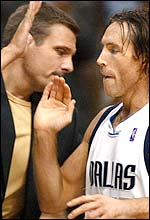 Steve Nash (right) celebrates his side's latest success with assistant coach Donn Nelson