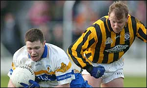 Errigal's Enda McGinley is challenged by Martin Califf during the Ulster Club quarter-final