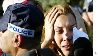 Police officer comforting a woman