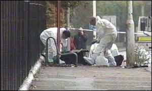 Bomb disposal experts search the scene