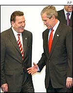 Mr Bush offers to shake Mr Schroeder's hand