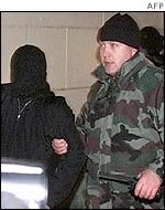 Russian special forces soldier leads suspected Chechen militant from siege 