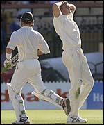 Andrew Caddick puts his head in his hands