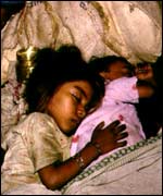 Children often sleep rough on the streets of Delhi's slums