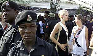 Nigerian guards surround unidentified Miss World contestant