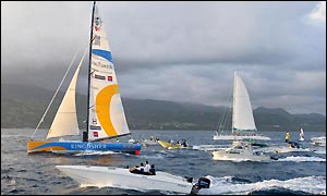 MacArthur is joined by a flotilla of boats as she approaches the finish