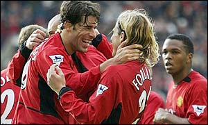 Ruud van Nistelrooy is congratulated by Diego Forlan after scoring his second goal