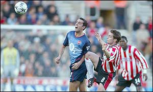 Arsenal midfielder Edu battles with Saints' Matthew Oakley