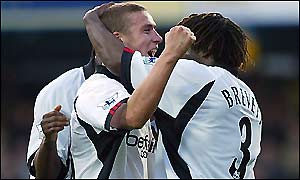 Rufus Brevett congratulates Sean Davis