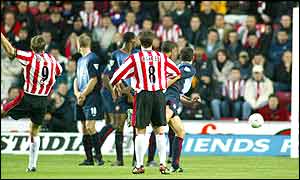 Southampton's James Beattie (left) scores the first-half equaliser