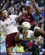 Dion Dublin puts the Hammers defence under pressure