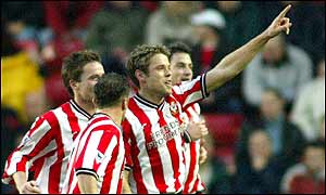 James Beattie accepts the home crowd's plaudits after his brace against Arsenal