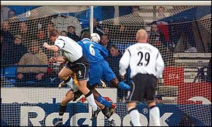 Henrik Pedersen rises above Marcel Desailly to give Bolton the lead