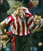 James Beattie celebrates scoring against Arsenal 