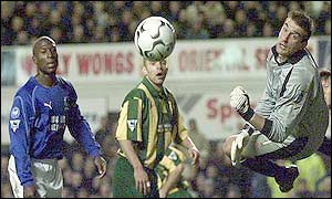 West Brom goalkeeper Russell Hoult (right) saves from Kevin Campbell (left)