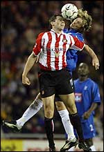 Sunderland's Kevin Kilbane contests a header with Birmingham's Robbie Savage