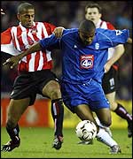 Blues goalscorer Clinton Morrison holds off Phil Babb