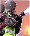 Armed forces firefighters tackle a blaze