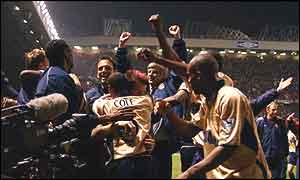 Arsenal's players celebrate at the title win at Old Trafford