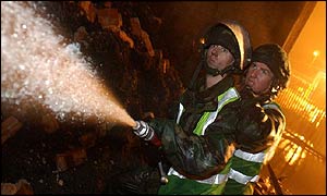 Soldiers fight a fire