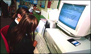 Children sitting at a computer