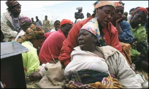 Women grieving for relatives killed by Aids