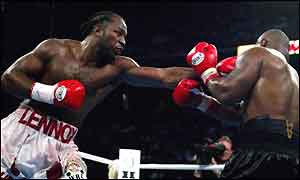 Lennox Lewis, heavyweight champ of the world, punishes Mike Tyson