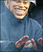A firefighter dressed as Tony Blair