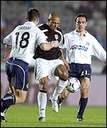 Fulham's Steve Marlet takes on the Hertha Berlin defence