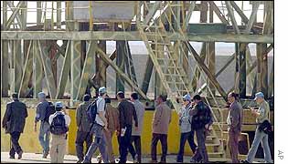 Inspectors look at metal structure in Amariyah graphite rod factory, south-west of Baghdad