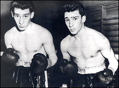 Ronnie and Reggie Kray in boxing outfits