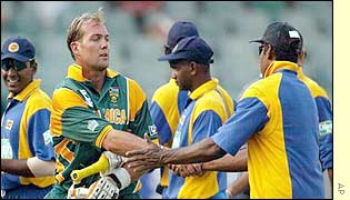 South African batsman Jacques Kallis, who scored 38, shakes hands with the Sri Lankan fielders 