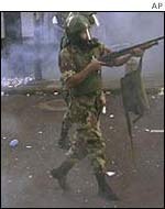 National guardsmen disperse a crowd