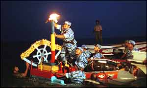 Sea Tiger chief lights a lamp to remember war dead near Mullaittivu 27 Nov 2002