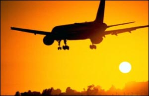 Airliner lands at dusk, Corbis