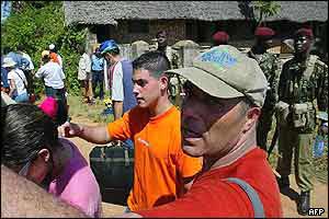 Tourists leave the hotel following the attack