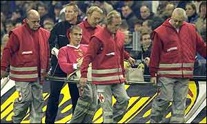 Liverpool midfielder Bruno Cheyrou is stretchered off